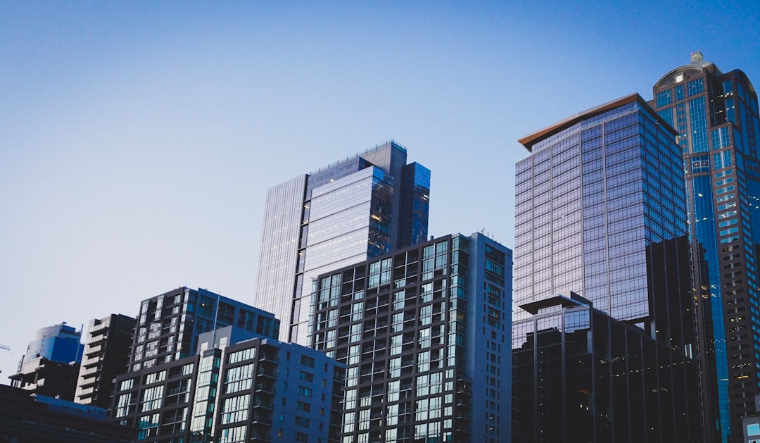 white-and-blue-glass-walled-high-rise-building-w3efhqxjkze